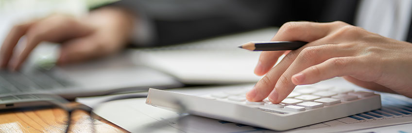 Accountant using calculator