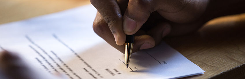 Person signing grant proposal