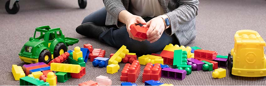 Teacher with building blocks