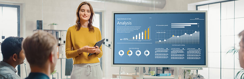 Analyst presenting data to group