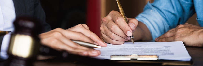 Notary Signing Agent signing document with client