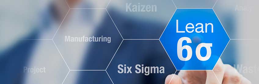 Businessman touching lean six sigma button for improved manufacturing