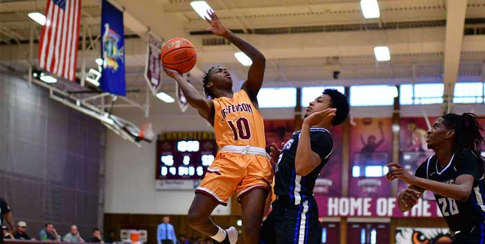 Cannoneer Basketball Player Jumping into defender