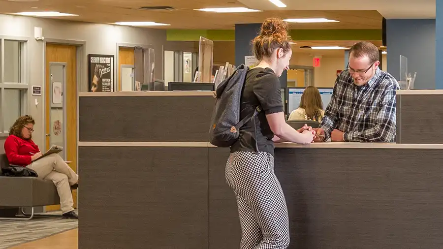 Student getting help from enrollment services