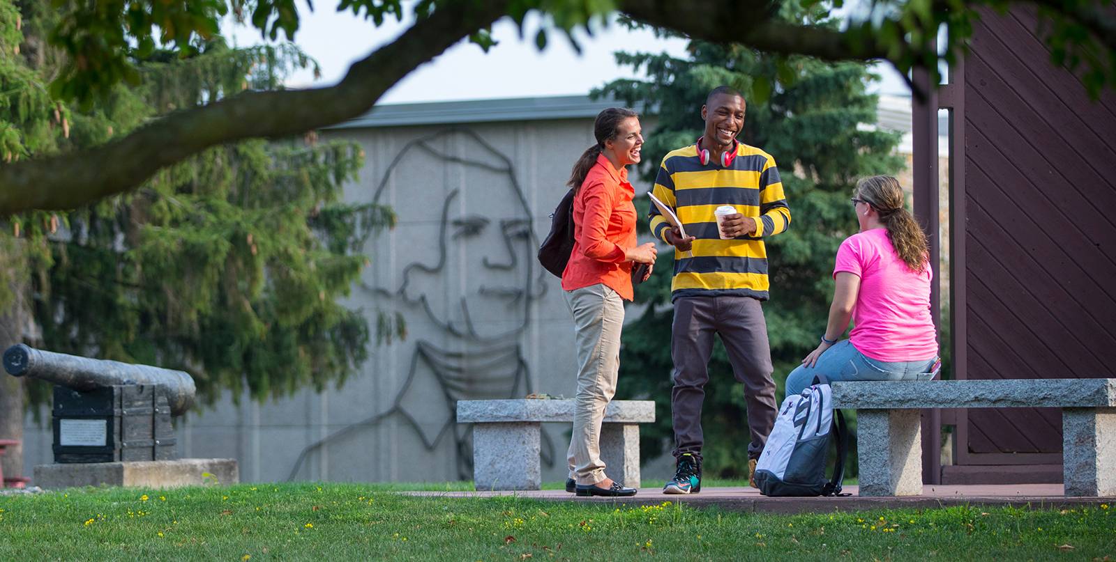 Students walking on campus on a sunny day
