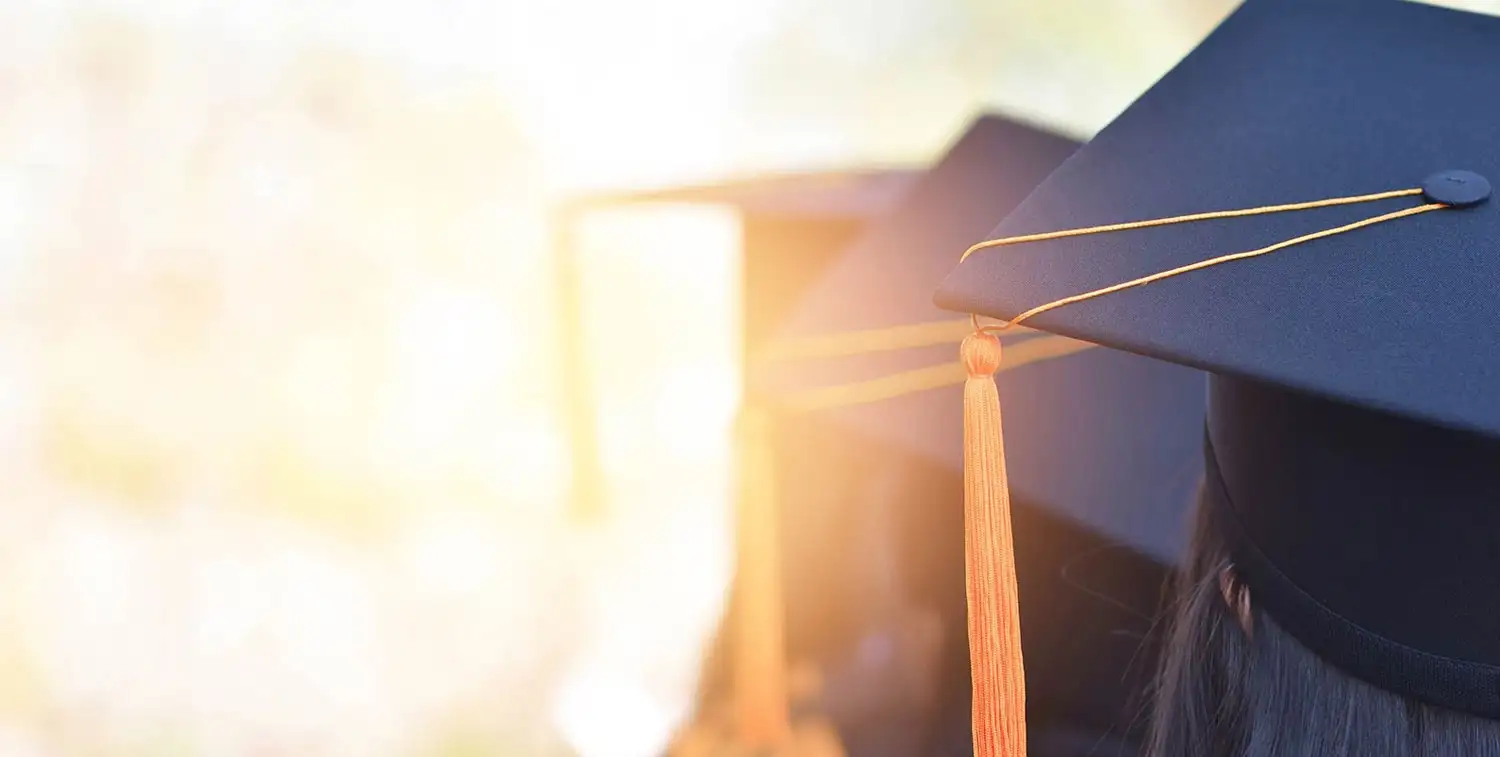 Students lined up in graduation caps for commencement