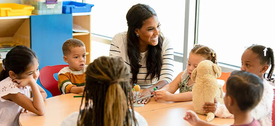 Teacher smiling with young students