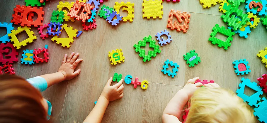 Childern playing with puzzle toys