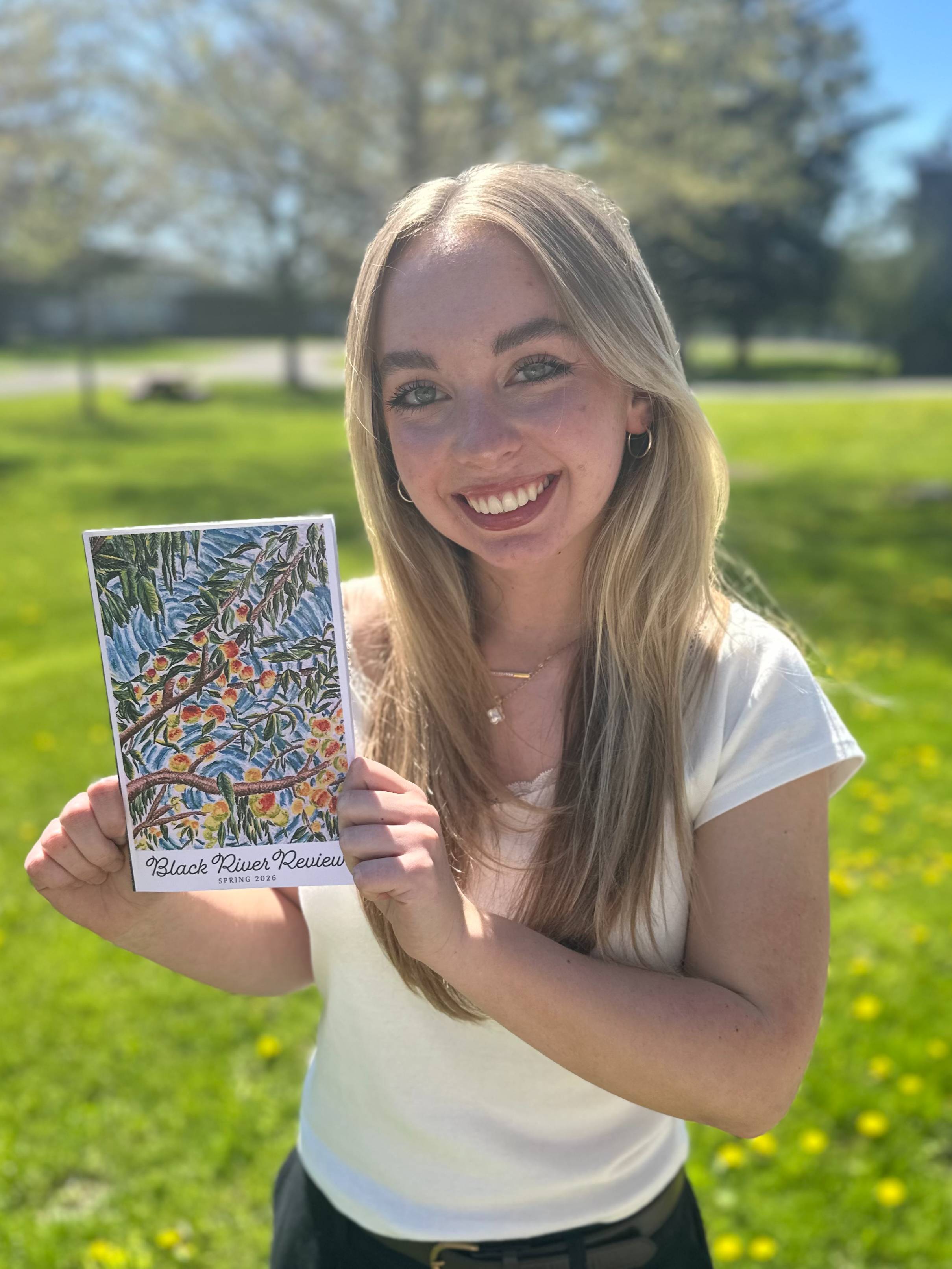 Image of Abigail Rudd Holding a Black River Review Journal